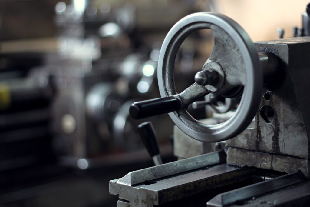 metal handle of the milling machine in an industrial plant.